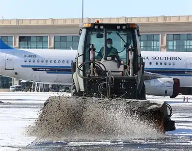 De-Icing Efficiency of Solid Potassium Acetate in Extreme Airport Winter Conditions