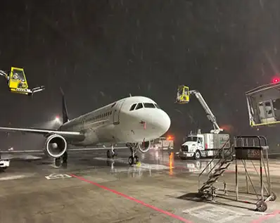 How do Potassium Acetate Snow Melting Liquids Affect Metal Surfaces Like Cars or Railings?